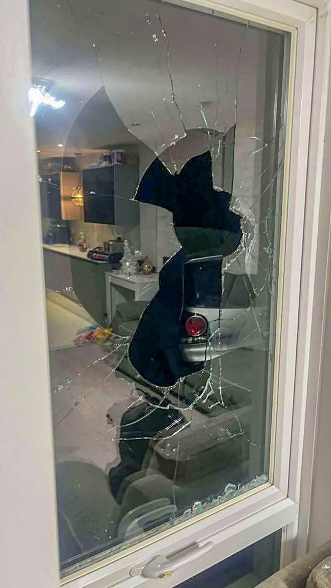 Pictured: The damage following an attack on a property on Allbrook Knoll, Eastleigh. Two care workers have been left 'terrified' after their family home was attacked by three hooded men who threw rocks into their children's bedroom. Their six year old daughter even asked 'Mummy, why would anyone want to hurt my windows?' following the late night assault which also saw eight tyres slashed. The mother, who only gave her name as Erica for fear of further attacks, and her unnamed husband heard the noise and thought there was an intruder in their home but when they went to investigate they only found smashed windows. They then rushed to check on their son and daughter's room where the pair found a smashed window and three rocks on their daughter's bed, Erica cut her foot on some glass in her rush to check on the children. SEE OUR COPY FOR DETAILS. Please byline: Daily Echo/Solent News ?? Daily Echo/Solent News & Photo Agency UK +44 (0) 2380 458800