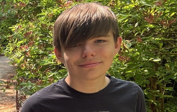 A photo of Joshua Myers in a black top.