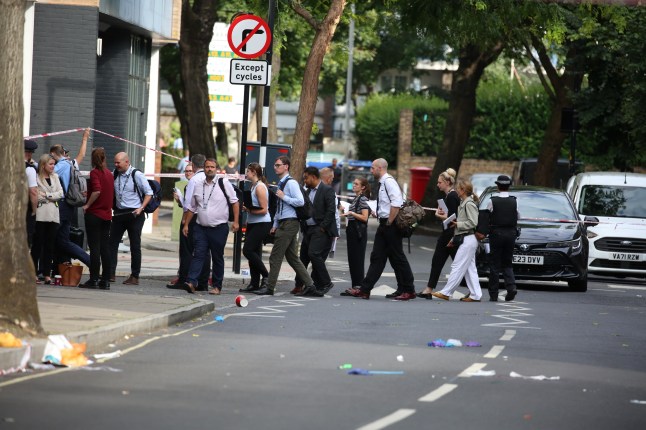 Workers try to leave the scene
