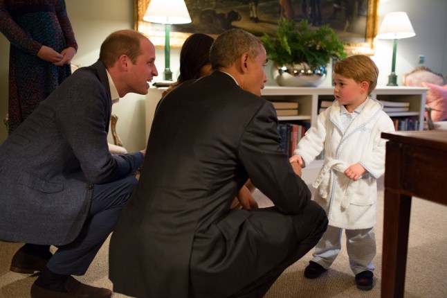 LONDON, ENGLAND - APRIL 22: In this handout provided by The White House, President Barack Obama, Prince William, Duke of Cambridge and First Lady Michelle Obama talks with Prince George at Kensington Palace on April 22, 2016 in London, England. The President and his wife are currently on a brief visit to the UK where they attended lunch with HM Queen Elizabeth II at Windsor Castle and later dinner with Prince William and his wife Catherine, Duchess of Cambridge at Kensington Palace. Mr Obama visited 10 Downing Street this afternoon and held a joint press conference with British Prime Minister David Cameron where he stated his case for the UK to remain inside the European Union. (Photo by Pete Souza/The White House via Getty Images)