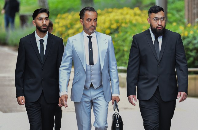 Human Rights lawyer Aamer Anwar (centre) arrives with Mohammed Fahir Amaaz (left) and Muhammed Amaad (right) at Liverpool Crown Court.