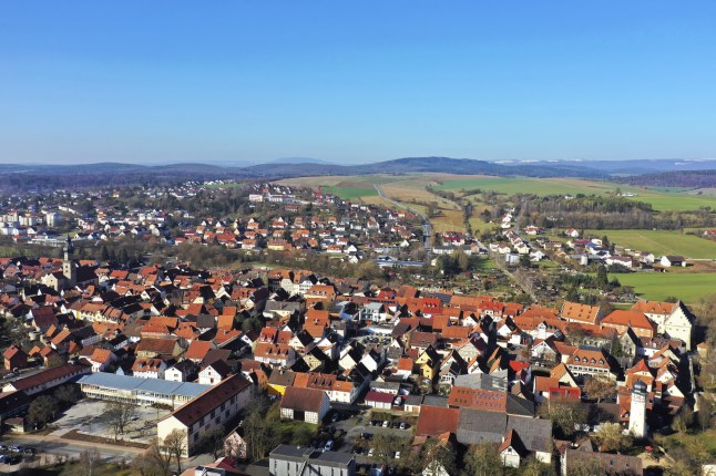 Aerial view of the historic town centre of Mellrichstadt with a view of the town wall and towers. Mellrichstadt, Rh??n-Grabfeld, Lower Franconia, Bavaria, Germany, Europe