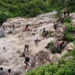Terrifying moment six girls swept away by a sudden flood surge towards waterfall’s edge 