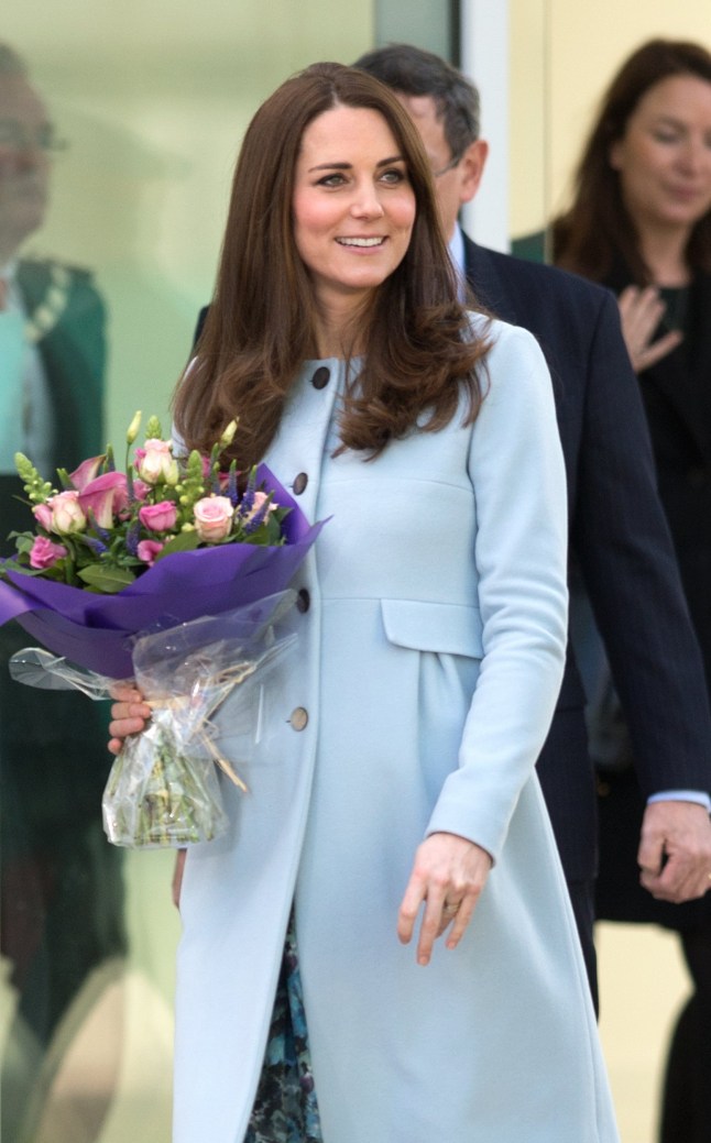 Catherine, Duchess of Cambridge, wearing a blue cashmere maternity coat by Seraphine, opens the Kensington Leisure Centre in London on January 19, 2015