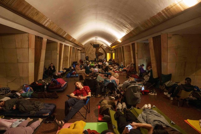 People sleep on the platform of a metro station as they take cover during a Russian attack on Kyiv, Ukraine, on Thursday, July 10, 2025. (AP Photo/Evgeniy Maloletka)
