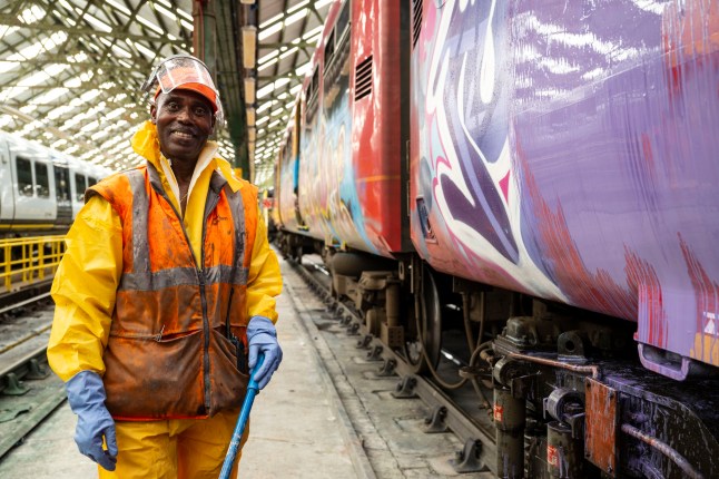 Train presentation teams clean the trains before service during Wimbledon at the Southwestern Railways Wimbledon depot. Picture: Jeff Asiedu - train presentation operative cleans graffiti from a Southwestern train. ?? Lucy Young 2025 07799118984 lucyyounguk@gmail.com www.lucyyoungphotos.co.uk