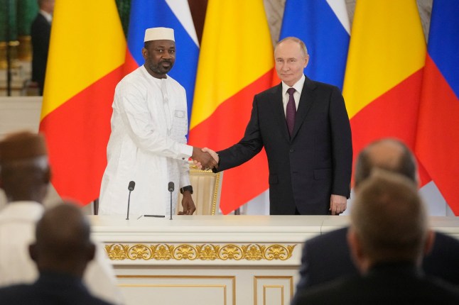 Russian President Vladimir Putin and Mali's junta leader Assimi Goita shake hands after a signing ceremony following their talks at the Kremlin in Moscow on June 23, 2025. (Photo by Pavel Bednyakov / POOL / AFP) (Photo by PAVEL BEDNYAKOV/POOL/AFP via Getty Images)