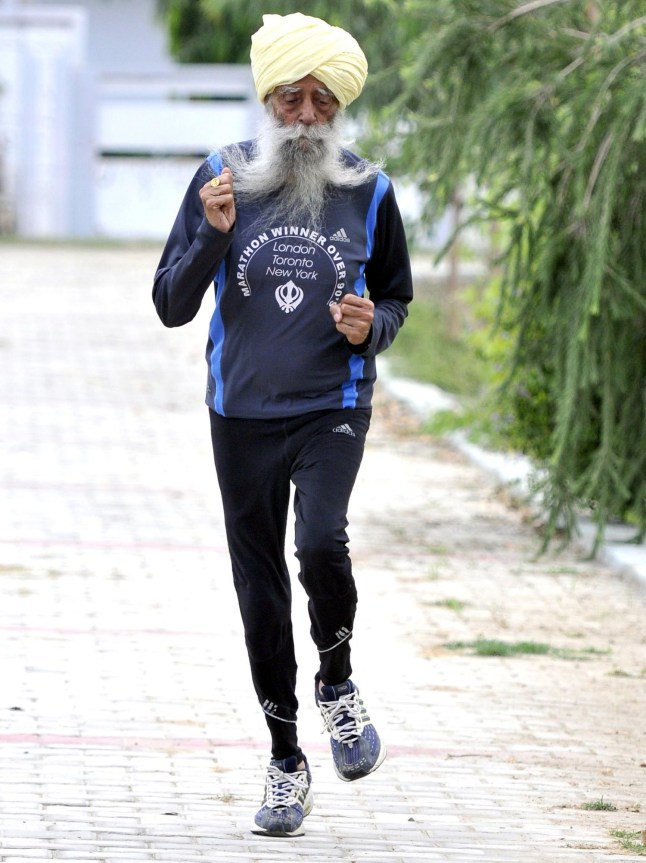 JALANDHAR, INDIA - SEPTEMBER 13: Veteran Marathon runner Fauja Singh poses during an exclusive interview with Hindustan Times on September 13, 2016 in Jalandhar, India. Fauja Singh is a British Sikh centenarian marathon runner of Punjabi Indian descent. He is a world record holder in his age bracket. His current personal best time for the London Marathon (2003) is 6 hours 2 minutes, and his marathon record, for age 90-plus, is 5 hours 40 minutes at the age of 92, at the 2003 Toronto Waterfront Marathon. (Photo by Keshav Singh/Hindustan Times via Getty Images)