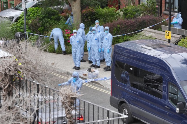 Forensic officers at an address in Shepherd's Bush, west London, after human remains were found