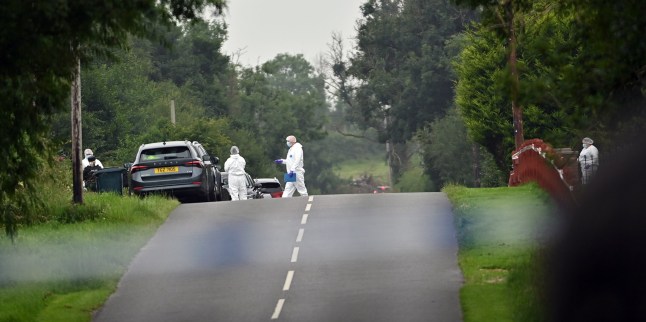 Forensic officers at scene in the Drummeer Road area of Maguiresbridge, Co Fermanagh, after two children and a woman have died in a shooting incident. Picture date: Wednesday July 23, 2025. PA Photo. Photo credit should read: Oliver McVeigh/PA Wire