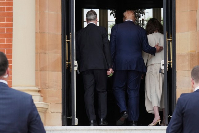 President Donald Trump, center, walks inside with Britain's Prime Minister Keir Starmer, left, and his wife Victoria after an official greeting at the Trump Turnberry golf course in Turnberry, Scotland Monday, July 28, 2025. (AP Photo/Jacquelyn Martin)