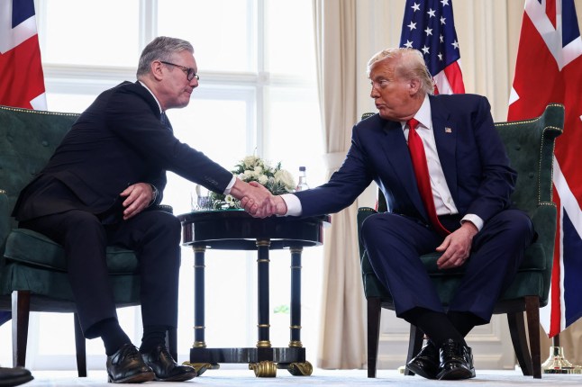 U.S. President Donald Trump and British Prime Minister Keir Starmer shake hands, during a bilateral meeting at Trump Turnberry golf course in Turnberry, Scotland, Britain, July 28, 2025. REUTERS/Evelyn Hockstein