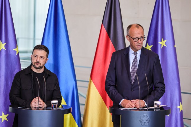 BERLIN, GERMANY - AUGUST 13: German Chancellor Friedrich Merz and Ukrainian President Volodymyr Zelensky attend a joint press conference at the Chancellery following a virtual meeting hosted by Merz between European leaders and U.S. President Donald Trump on August 13, 2025 in Berlin, Germany. The meeting was meant to clarify the European position prior to talks scheduled for Friday between Trump and Russian President Vladimir Putin in Alaska on reaching an end to the Russian war in Ukraine. (Photo by Omer Messinger/Getty Images)