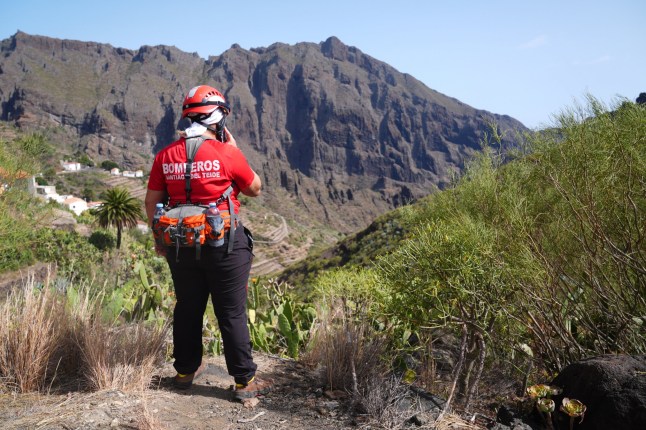 A firefighter looks over the village of Masca, Tenerife, where the search for missing British teenager Jay Slater, 19, from Oswaldtwistle, Lancashire, continues.?Picture date: Saturday June 22, 2024. PA Photo. Mr Slater was last heard from on Monday morning whilst attempting to walk back to his accommodation when he missed a bus, after staying with people he met at the NRG music festival in Tenerife, Spain's Canary Islands. See PA story POLICE Tenerife. Photo credit should read: James Manning/PA Wire
