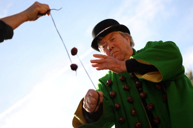 David Jakins, known as 'King Conker', takes part in the annual World Conker Championships in Southwick, Britain, October 13, 2024. REUTERS/Phil Noble TPX IMAGES OF THE DAY