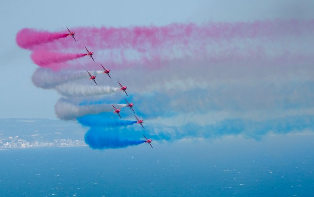 The RAF Red Arrows during the Eastbourne Air Show 2025 on August 17, 2025 in Eastbourne, England.