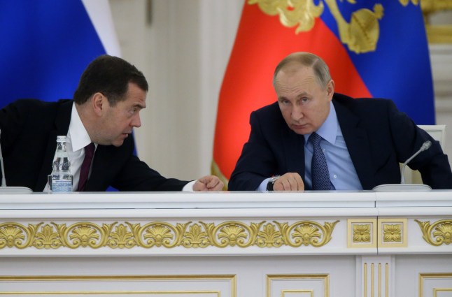Russian President Vladimir Putin (R) listens to Prime Minister Dmitry Medvedev (L) during the State Council's meeting at Grand Kremlin Palace on December 26, 2019 in Moscow, Russia. Putin warned the United States again this week on an escalating arms race, saying that Russia has become the first country to deploy hypersonic missiles that can carry nuclear weapons at a speed 20-times faster than sound.