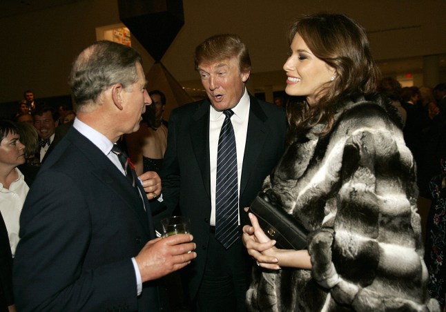New York, UNITED STATES: Britain's Prince Charles (L) talks with Donald Trump (C) and his wife Melania (R) during a reception at the Museum of Modern Art 01 November 2005 in New York. The first official overseas trip since the marriage in April of Prince Charles and his wife Camilla, Duchess of Cornwall, comes 20 years after the frenzy that greeted the US visit of the prince and his then-wife, the late Princess Diana. AFP PHOTO/Timothy A. CLARY (Photo credit should read TIMOTHY A. CLARY/AFP via Getty Images)