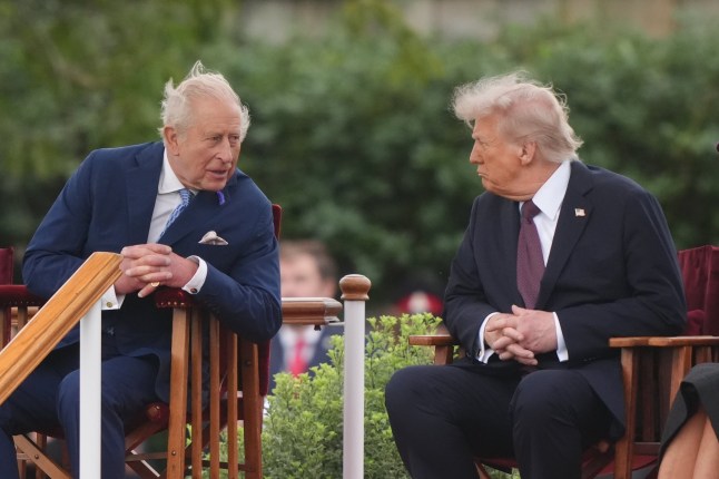 WINDSOR, ENGLAND - SEPTEMBER 17: US President Donald Trump (R) joins King Charles III to observe a Beating Retreat ceremony at Windsor Castle on September 17, 2025 in Windsor, England. President Trump is in England from Sept. 16-18 on his second UK state visit, with the previous one taking place in 2019 during his first presidential term. (Photo by Jonathan Brady - WPA Pool/Getty Images)
