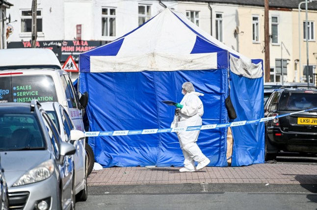 Forensics and police at the scene of a shooting in Leicester Street in Wolverhampton, where one man has died and another is in hospital in a critical condition. September 19 2025. // Police are hunting a gunman after a man was shot dead and another left fighting for his life, following a horror early morning attack. Emergency services were called after the two men were blasted while they were sat in a vehicle just after 3.10am this morning (Fri). One man, aged in his 20s was pronounced dead at the scene on Leicester Street in the Whitmore Reans area of Wolverhampton. The second victim, aged in his 30s, was taken to hospital with injuries which are believed to be life threatening. West Midlands Police has now launched a murder investigation and urged any witnesses to contact the force. Photo released 19/09/2025