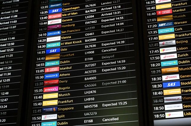LONDON, UNITED KINGDOM - SEPTEMBER 20: A view of cancelled and delayed flight information displayed at a flight information board as technical issue causes by a cyberattack on a third-party system provider led to congestion in Heathrow Airport, in London, United Kingdom on September 20, 2025. Due to baggage drop-off and check-in procedures being carried out manually, terminals experienced delays. (Photo by Rasid Necati Aslim/Anadolu via Getty Images)