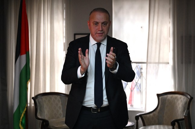 Head of the Palestine Mission to the UK, Husam Zomlot reacts as he watches a television broadcast of Britain's Prime Minister Keir Starmer formally recognising The Palestinian State on September 21, 2025 at their Mission in west London. Britain was set Sunday to recognise a Palestinian state with a landmark announcement due from Prime Minister Keir Starmer, as several nations were poised to follow at UN talks to pressure Israel over the Gaza war. (Photo by JUSTIN TALLIS / AFP) (Photo by JUSTIN TALLIS/AFP via Getty Images)