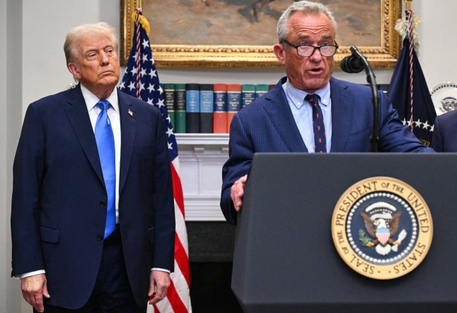 (L/R) US President Donald Trump looks on as US Secretary of Health and Human Services Robert F. Kennedy Jr. speaks during an event about autism in the Roosevelt Room of the White House in Washington, DC on September 22, 2025. (Photo by SAUL LOEB / AFP) (Photo by SAUL LOEB/AFP via Getty Images)