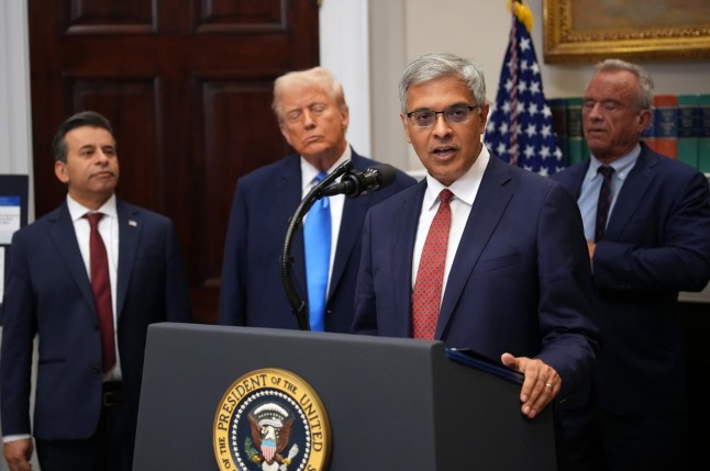 WASHINGTON, DC - SEPTEMBER 22: U.S. Director of the National Institutes of Health Jay Bhattacharya, joined by (L-R) Food and Drug Administration Commissioner Dr. Marty Makary, President Donald Trump and Health and Human Services Secretary Robert F. Kennedy Jr., delivers remarks during an announcement by President Donald Trump on ???significant medical and scientific findings for America???s children??? in the Roosevelt Room of the White House on September 22, 2025 in Washington, DC. Federal health officials suggested a link between the use of acetaminophen during pregnancy as a risk for autism, although many health agencies have noted inconclusive results in the research. (Photo by Andrew Harnik/Getty Images)
