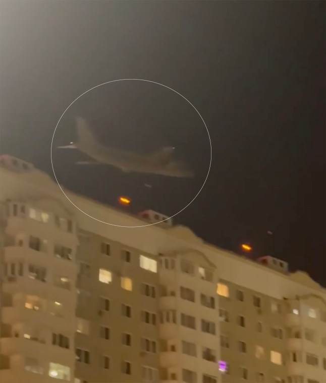 A dramatic flyover as a giant An-124 Ruslan plane - one of the world???s largest cargo aircraft- was forced to skim tower rooftops in Moscow escaping a Ukrainian kamikaze drone attack