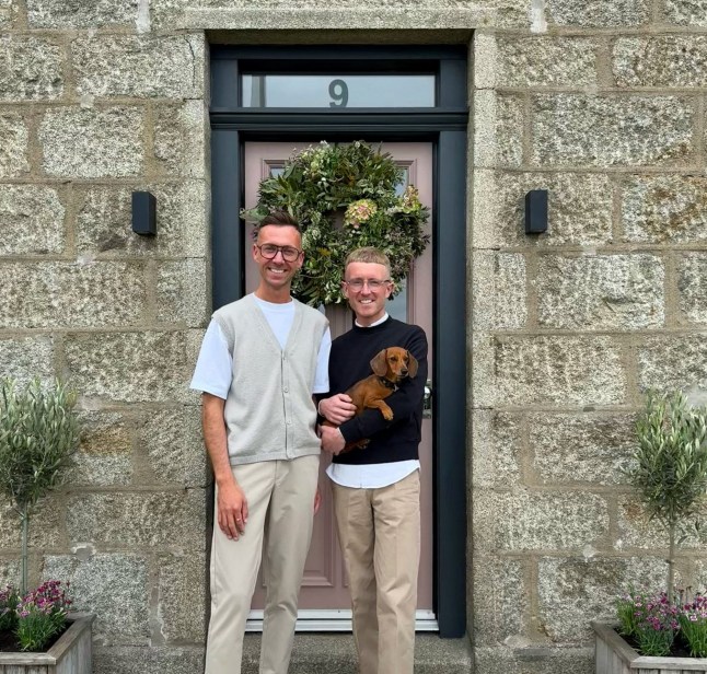 Mark Cunningham, left, and Mark Strachan with Chip the dog. // A couple who bought their grandparent's old cottage were stunned when they renovated it - and found notes from them behind the wallpaper. The grey cottage in the Aberdeenshire village of New Deer used to belong to Mark Strathan's late grandparents, Nellie and Wullie. When Mark Strathan and Mark Cunningham stripped the old wallpaper they uncovered notes on the walls - including handwritten signatures by Mr Strathan's grandparents. Photo released 28/09/2025