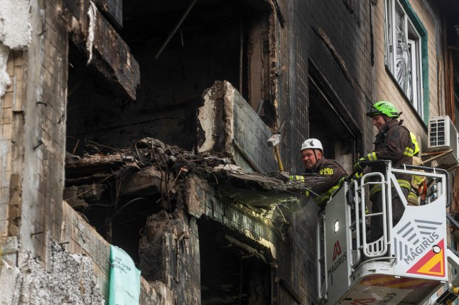 epa12412585 Rescuers work at the site of a Russian strike on a residential building in Kyiv, Ukraine, 28 September 2025, amid the Russian invasion. Russia launched a large-scale overnight attack across Ukraine using nearly 500 drones and 40 missiles, killing at least four people and injuring scores, according to the State Emergency Service. EPA/MAXYM MARUSENKO