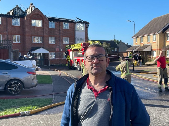 A ‘hero’ resident described how he fought through smoke filled corridors to evacuate families as a blaze ripped through the block. Yunus Mert, 45, raced from his ground floor apartment after he made sure his wife and daughter, 9, were safe. He told Metro: ‘There was smoke everywhere. I was choking but I battled my way up the stairs to make sure everyone got out. I was banging on doors. There were children and families I made sure they got out. The fire started in a flat bar the top. There were kids I needed to get out - the smoke was thick I knew we didn’t have much time.’ Yunus, a courier, has been evacuated to a community centre nearby. He added: ‘It was my birthday yesterday just thanks everyone is alive.’ Councillor Rick Jewell was on the scene just minutes after the fire started. He said: ‘There was a crack and then huge flames and a mushroom of smoke. The air was filled with smoke. Every time the firefighters put water on one bit of the roof another flared up.’ The cabinet member on Enfield Council added: ‘We are helping residents and taking them to a community centre so st least they can have a cuppa. It’s terrible