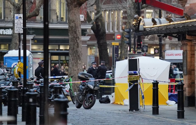 A police tent is erected at Cambridge Circus on the junction between Shaftesbury Avenue and Charing Cross Road in London, after a man has been crushed by a telescopic urinal. Fire crews said the man has been freed and is in the care of the London Ambulance Service. Roads in the area have been closed. Picture date: Friday January 27, 2023. PA Photo. See PA story POLICE Urinal. Photo credit should read: Jonathan Brady/PA Wire