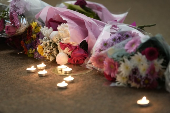 NOTTINGHAM, ENGLAND - JUNE 13: Flowers and candles lay at the altar after being placed by friends of the deceased during a vigil at St Peter???s Church in the city centre on June 13, 2023 in Nottingham, England. Nottinghamshire police said a man had been arrested on suspicion of murder after three people were found dead earlier today in areas of Nottingham City Centre. (Photo by Christopher Furlong/Getty Images)
