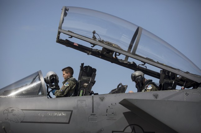 A United States Air Force (USAF) pilot, left, and weapons systems officer sit in the cockpit of a Boeing Co. F15-E Strike Eagle combat aircraft as the 48th Fighter Wing of the United States Air Force (USAF) participates in 'Point Blank', a joint exercise with NATO allies from their American base at Royal Air Force Lakenheath, near Brandon, Suffolk, U.K., on Thursday, June 27, 2019. 'Point Blank' focuses on fourth and fifth generation aircraft integration across three nations with a total of 48 aircraft meeting in the skies over the North Sea, said Lt. Col. Jason Watkins, commander of the 48th Operations Support Squadron. Photographer: Simon Dawson/Bloomberg via Getty Images