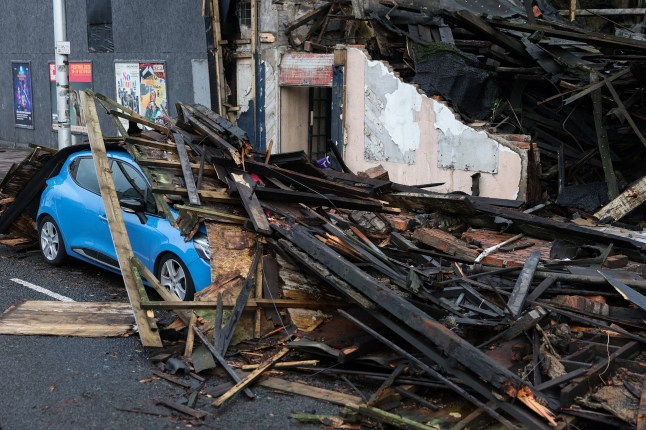 GLASGOW - OCTOBER 04: Debris from a collapsed building is seen on a car on the Broomielaw on October 04, 2025 in Glasgow, Scotland. The??Met Office??has issued seven??weather warnings ahead of Storm Amy, which is expected to bring??winds of up to 95mph to northern and western areas on Friday, and all of the country on Saturday. (Photo by Jeff J Mitchell/Getty Images)