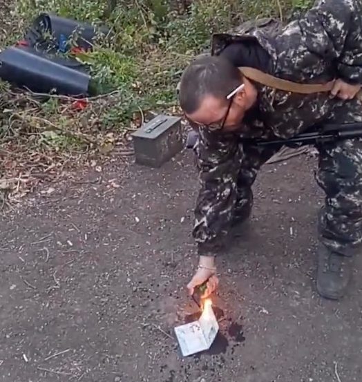 Aiden Wolfovich Minnis 15164635 British traitor burns his passport on social media UNCLEARED CREDIT - X/WolfovichIrish