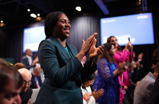 Conservative Party Leader Kemi Badenoch applauds during British Shadow Chancellor of the Exchequer Sir Mel Strides speech at the Conservative Party Conference in Manchester
