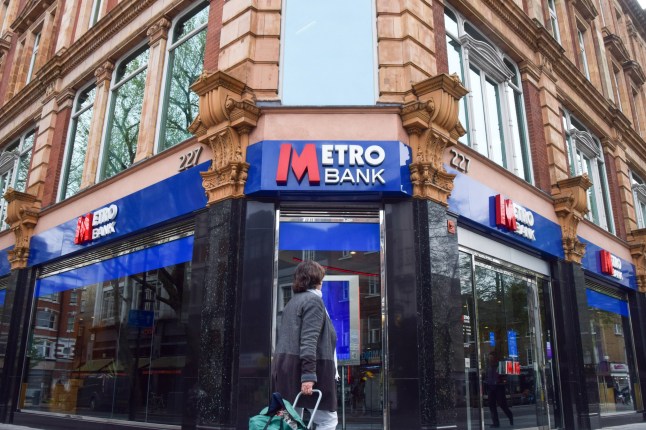 LONDON, UNITED KINGDOM - 2024/04/08: A woman walks past a Metro Bank branch in Central London. (Photo by Vuk Valcic/SOPA Images/LightRocket via Getty Images)