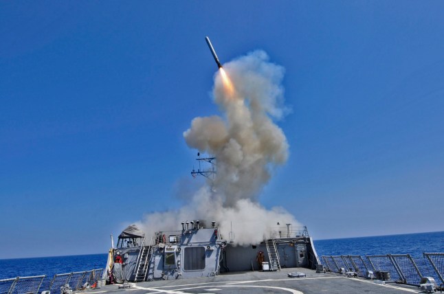 March 29, 2011 - The guided missile destroyer USS Barry (DDG-52) launches a Tomahawk cruise missile from the Mediterranean Sea in support of Operation Odyssey Dawn.