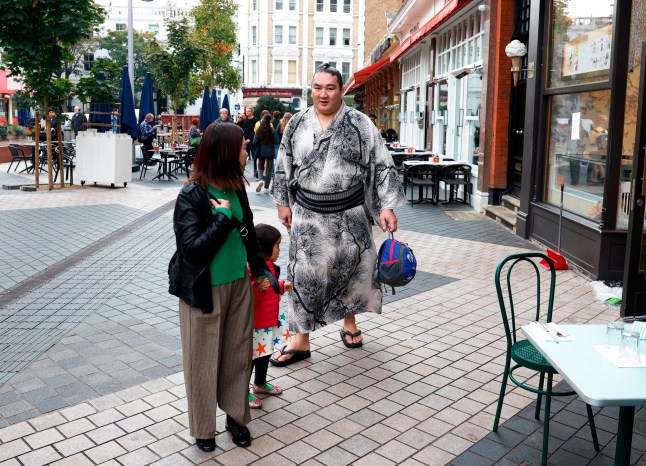 Sumo Wrestling - The Grand Sumo Tournament - Preview - Royal Albert Hall, London, Britain - October 12, 2025 A sumo wrestler known as Rikishi, is seen walking near the Royal Albert Hall. The tournament marks only the second time that Japan's iconic sport has visited the UK, following on from the previous event in 1991. Action Images via Reuters/Peter Cziborra