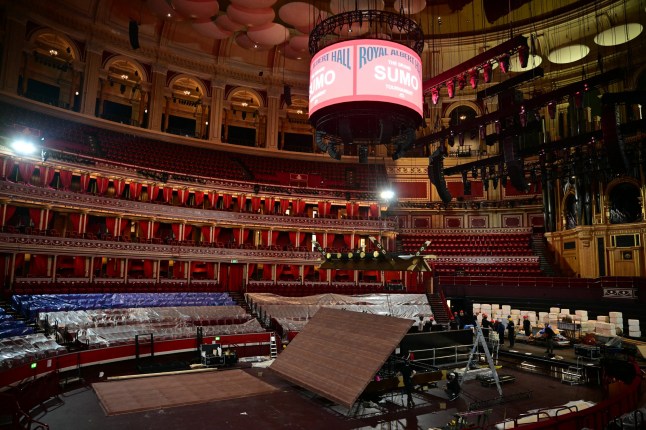 Construction of the roof above the dohyo begins, as preparations are underway inside the Royal Albert Hall in central London on October 12, 2025, ahead of the Grand Sumo Tournament being held over five days in London from October 15th. Over 40 of Japan's elite maku-uchi rikishi (wrestlers) will compete in London this week, bringing with them the 1,500-year legacy of Sumo, 34 years after the venue last hosted the Tournament. (Photo by Ben STANSALL / AFP) (Photo by BEN STANSALL/AFP via Getty Images)