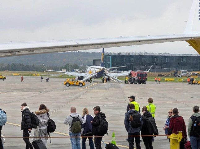 Passengers evacuate brand new Ryanair aircraft after crew spot smoke in cabin TAKEN WITHOUT PERMISSION PLEASE LEGAL Credit: Reddit