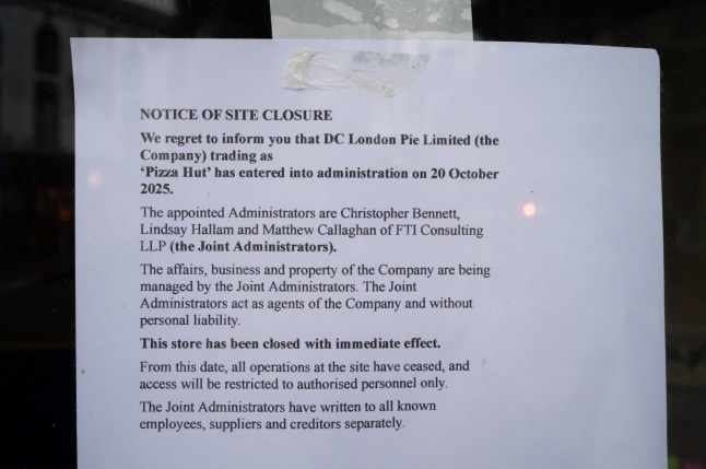CARDIFF, WALES - OCTOBER 20: Signs in the window of a closed Pizza Hut store on Queen Street on October 20, 2025 in Cardiff, Wales. Pizza Hut is to close 68 restaurants and 11 delivery sites in the UK with the loss of 1,210 jobs, after the firm running them fell into administration. (Photo by Matthew Horwood/Getty Images)