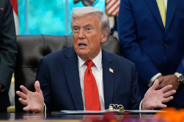 President Donald Trump answers questions from reporters during a Diwali celebration in the Oval Office at the White House, Tuesday, Oct. 21, 2025, in Washington. (AP Photo/Manuel Balce Ceneta)