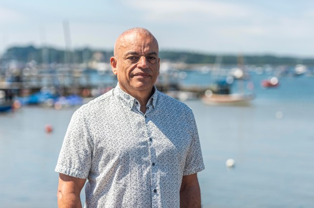 BNPS.co.uk (01202 558833) Pic: MaxWillcock/BNPS Pictured: Sandbanks Community Group secretary and retired barrister Alan Lester. Get orf my beach.. Sandbanks residents have instructed lawyers to take legal action after a 'public' beach behind a row of multi-million mansions was fenced off in an apparent 'land-grab'. For decades people have enjoyed unrestricted access to the sandy foreshore on the northern side of the exclusive peninsula in Poole Harbour, Dorset. It is a favourite spot for dog walkers, sea swimmers and paddlers and for those taking in a sunset stroll.