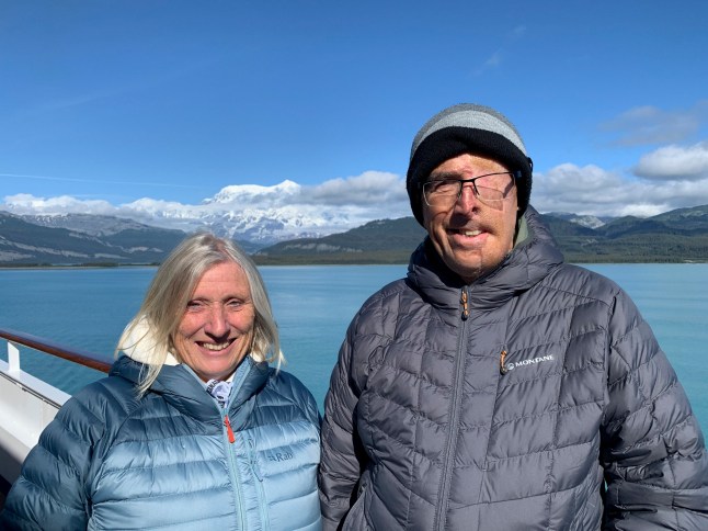 FILE PICTURE - COLLECT - Dave Richards and his wife after the crash. // A cyclist injured by a drunk driver is the first to benefit from a unique NHS body parts printing centre - that built him a 3D face. Dave Richards, 75, was 'lucky to survive' the crash which damaged his back and pelvis and saw him break multiple ribs on one side of his body. He also received full thickness burns to the side of his face including his eye, nose and part of his neck. During his recovery, he was referred to Reconstructive Prosthetics, which has just opened The Bristol 3D Medical Centre. It is the first of its kind in the UK to have 3D scanning, design and printing of this kind in a single NHS location. The centre, based in Frenchay, Bristol, provides scientific and technical support to trauma patients through state-of-the-art digital technology and specialist reconstructive expertise. Dave, from Devon, was able to use the services at the centre after the accident. Photo released 27/10/2025