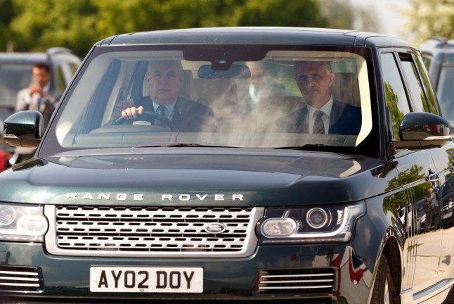 Prince Andrew at the wheel of his Range Rover in Windsor with the Duke of York personalise number plate.