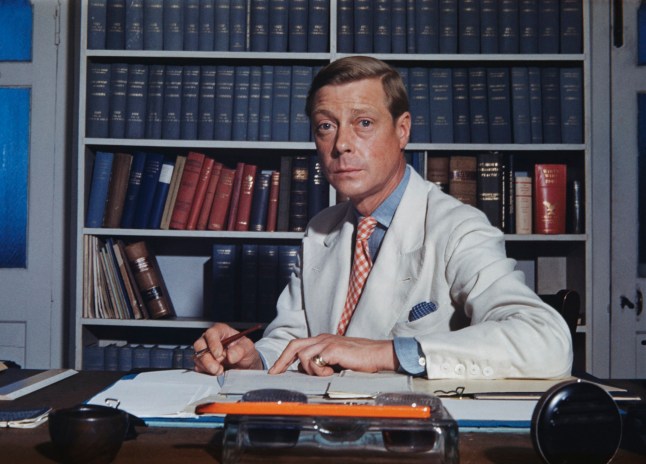 The Duke of Windsor (1894-1972) sitting at a desk, which is strewn with books and paperwork in Goverment House in Nassau, the Bahamas, circa 1942. The Duke of Windsor served as Governor of the Bahamas from 1940 to 1945. (Photo by Ivan Dmitri/Michael Ochs Archives/Getty Images)