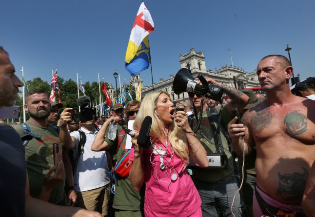Kate Shemirani adresses the protesters through a megaphone in Parliament Square as part of a freedom protest on July 19, 2021 in London, England.